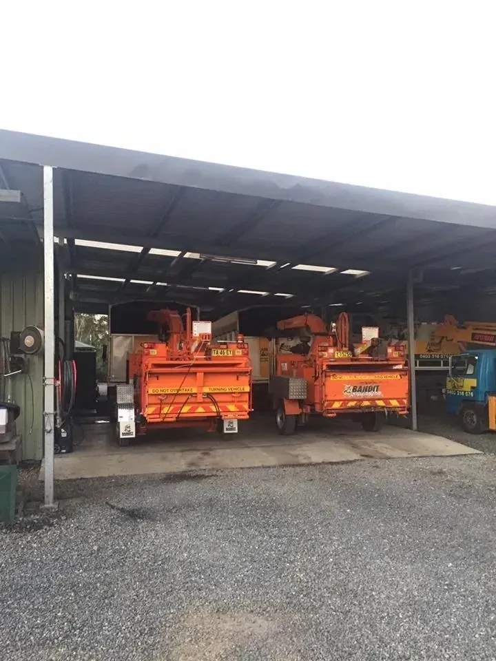 Ability Tree Service trucks and chippers at the Darawank yard