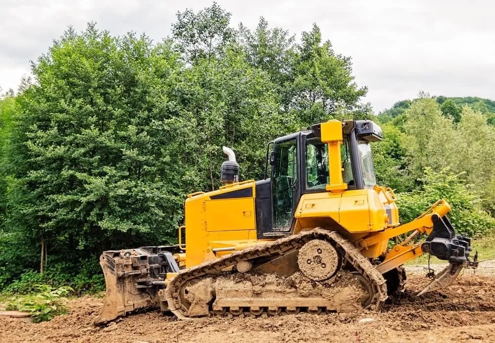 Machinery clearing land and scrub